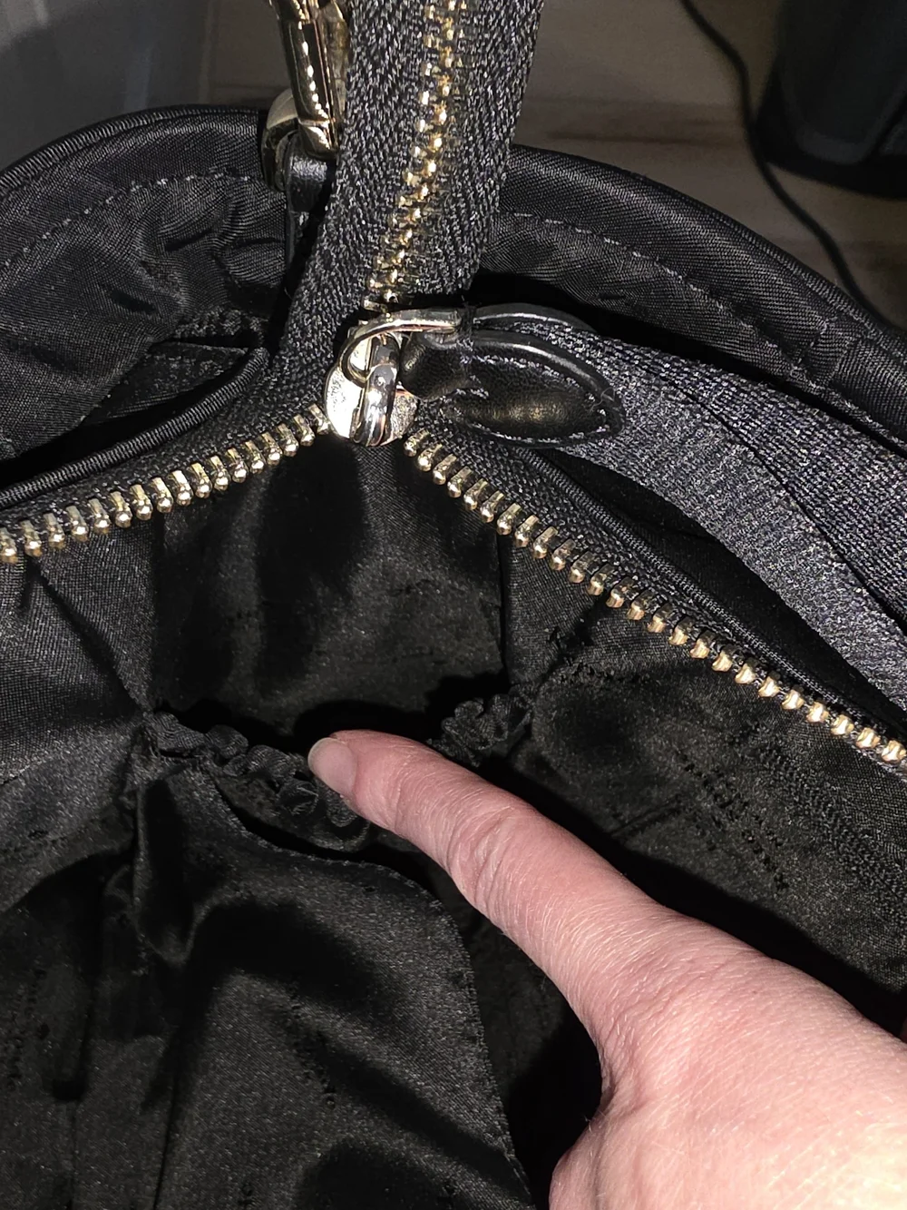 kate spade black tote with gold-tone logo and zipper